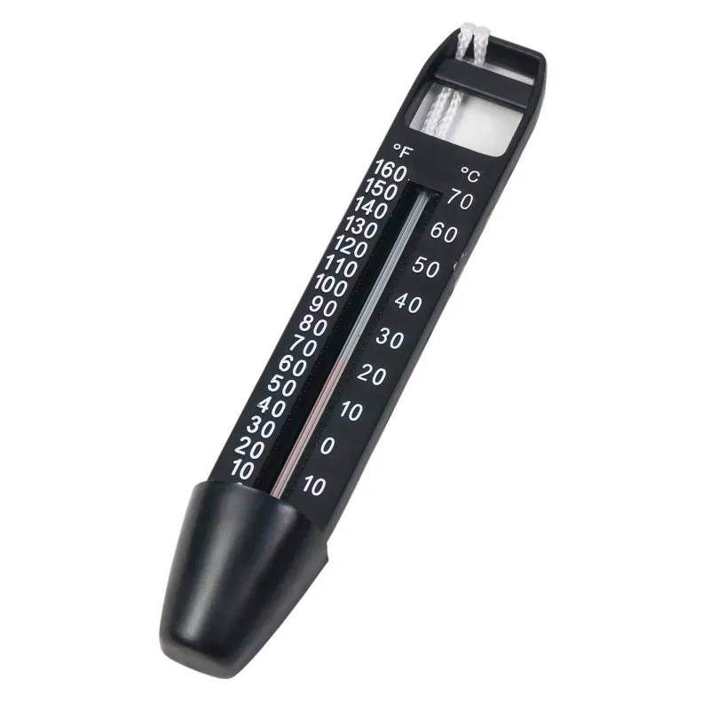 Svart flyttermometer med temperaturskala i Fahrenheit och Celsius, snöre upptill och avrundad spets nedtill.